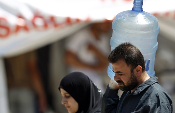 Refugiados sírios no acampamento na Turquia