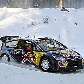 O finlandês Kimi Raikkonen contorna curva na neve com seu Citroen em etapa do Mundial de Rali