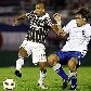 Emerson, do Fluminense, disputa a bola com Iván Coates, do Nacional, que venceu por 2 a 0 Emerson, do Fluminense, disputa a bola com Iván Coates, do Nacional, que venceu por 2 a 0