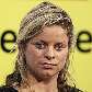 A tenista belga Kim Clijsters observa jornalistas em entrevista coletiva em Mechelen, na Bélgica A tenista belga Kim Clijsters observa jornalistas em entrevista coletiva em Mechelen, na Bélgica
