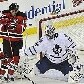 Sestito, do NJ Devils, desvia do disco, ao lado do goleiro Jonas Gustavsson, do Toronto Maple Leafs