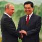 Vladimir Putin é recebido por Hu Jintao em Pequim Vladimir Putin é recebido por Hu Jintao em Pequim