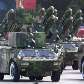 Veículos militares participam de desfile para comemorar o 60º aniversário da República Popular