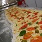 Pizzaiolo faz pizza gigante para celebrar o dia da iguaria 