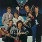 A banda Dire Straits ajuda a divulgar o compact disc, em cartaz do início dos anos 1980