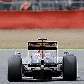 Sebastien Buemi, da Toro Rosso, contorna curva em treino livre da F-1 na Inglaterra Sebastien Buemi, da Toro Rosso, contorna curva em treino livre da F-1 na Inglaterra