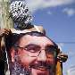 Israelita árabe mostra poster do líder da Hezbollah, Sheik Hassan Nasrallah, durante protesto