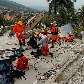 Equipe do Corpo de Bombeiros do Brasil busca por sobreviventes no hotel Montana