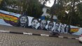 Grafiteiro homenageia vítimas em muro da escola Raul Brasil, em Suzano