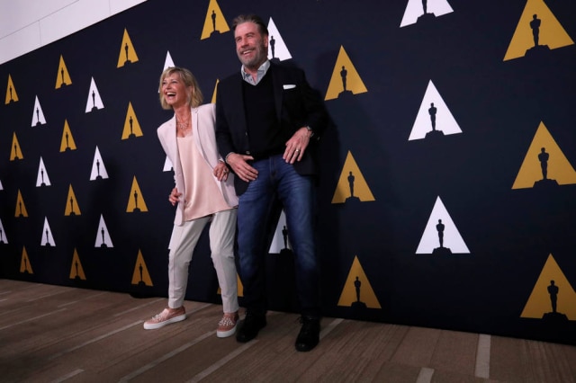 REUTERS/Mario Anzuoni John Travolta e Olivia Newton-John em comemoração de 'Grease'.