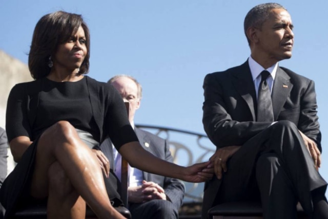 Saul Loeb/AFP Michelle Obama e Barack Obama .