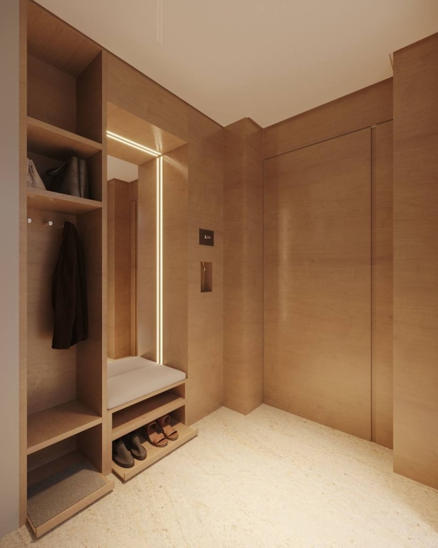 Marcelo Rosset Arquitetura Penduradores, sapatos e prateleiras ficam ocultos no hall projetado por Marcelo Rosset