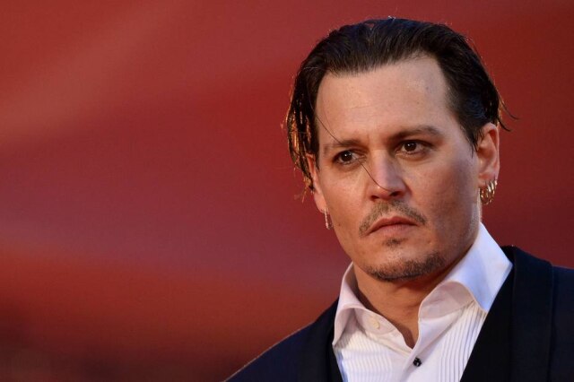 Tiziana Fabi/AFP Johnny Depp já se divorciou uma vez