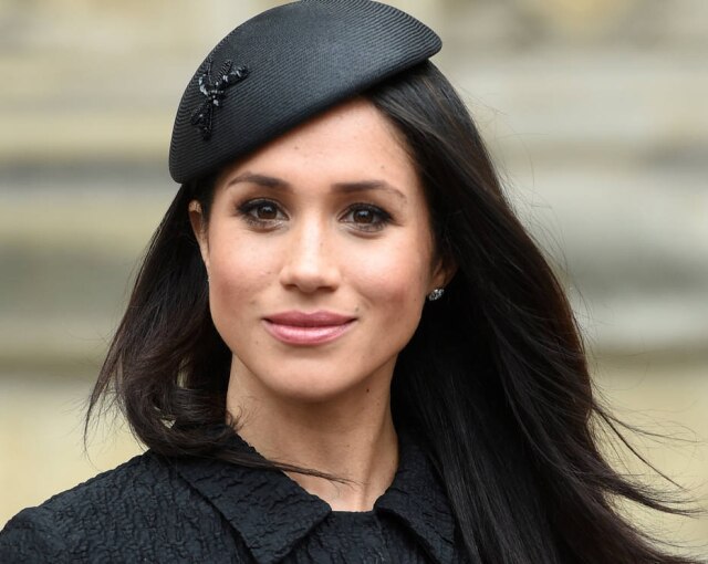 Eddie Mulholland / Pool via Reuters Meghan Markle