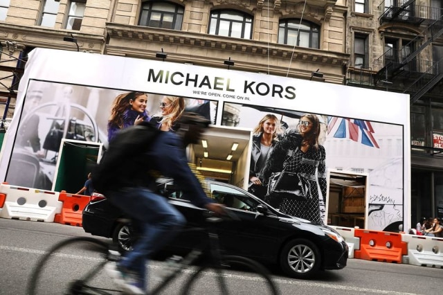 Spencer Platt/Getty Images/AFP A Michael Kors é uma das maiores grifes do 'mercado de luxo acessível'