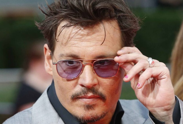Tobias Schwarz/Reuters Johnny Depp travou uma briga judicial com a empresa que fazia sua gestão financeira.