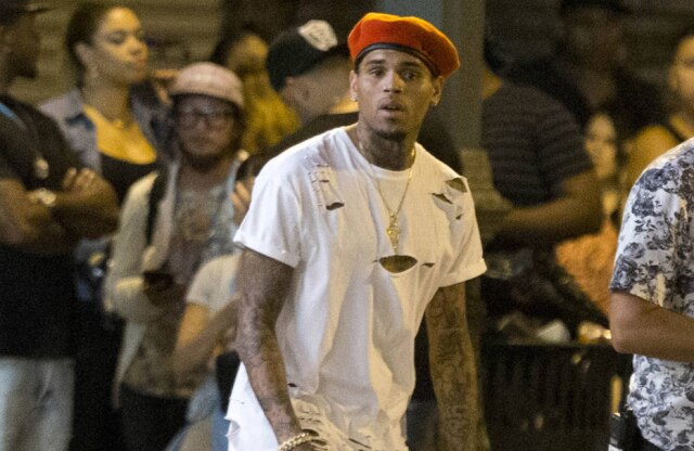 Bang Showbiz Chris Brown shows off his brand new $165,000 Rezvani Beast supercar on the set of the 'Liquor' music video in Downtown Los Angeles.