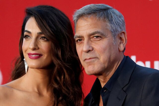 Mario Anzuoni / Reuters George Clooney e sua mulher, Amal