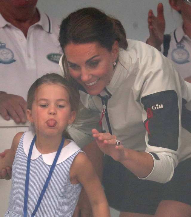 Catherine, Duchess of Cambridge with Princess Charlotte look through a window at the prize giving after the King's Cup Regatta in Cowes, the Isle of Wight, Britain August 8, 2019. Andrew Matthews/Pool via REUTERS